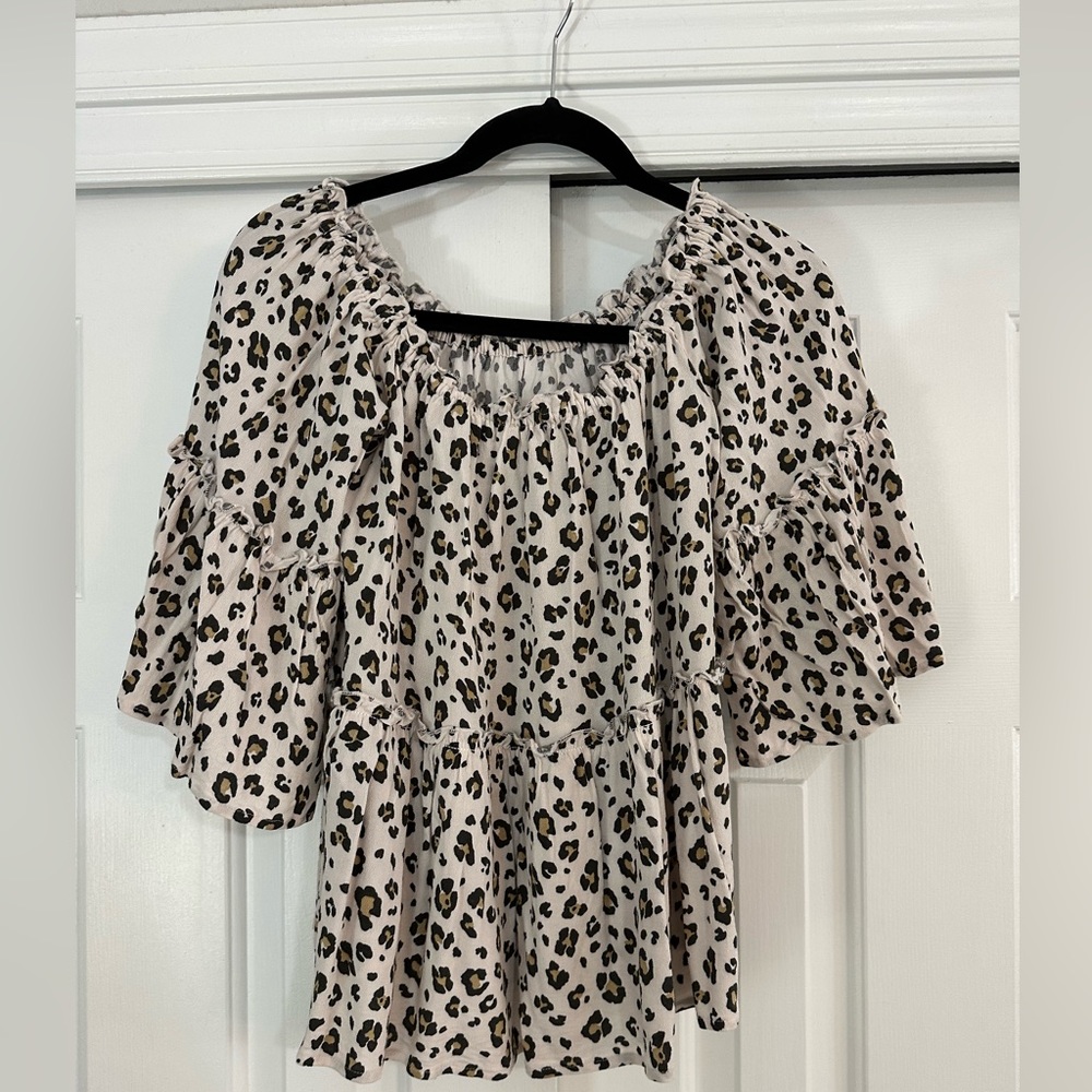 Off the shoulder. Cheetah print top with bell sleeve